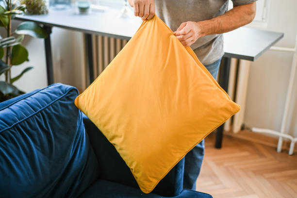 Fresh cushion cover being handled